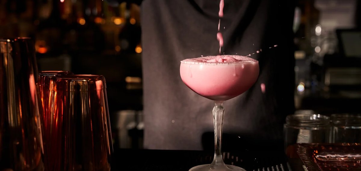 A cocktail being poured at Vine Bar